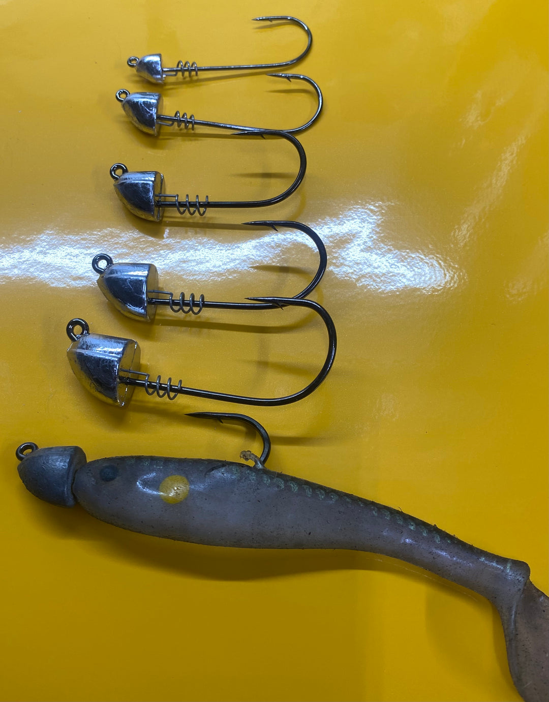 thumbnail image 2 of 15 PCS Shad Head Jig Bass Lures – 1.5 Oz, #5/0 Stainless Hook, Unpainted Lead 2 of 5